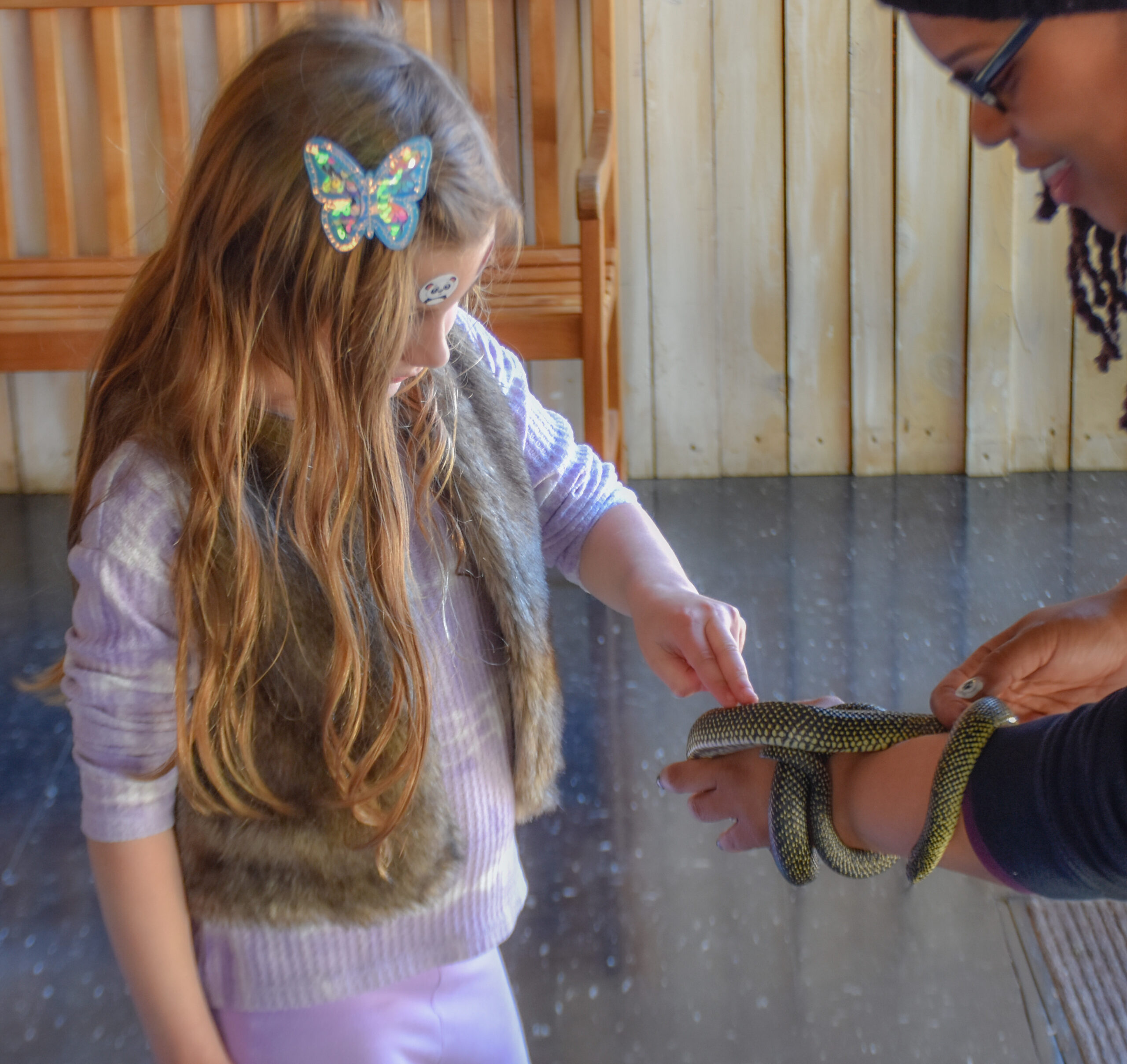 Educator presenting a live animal